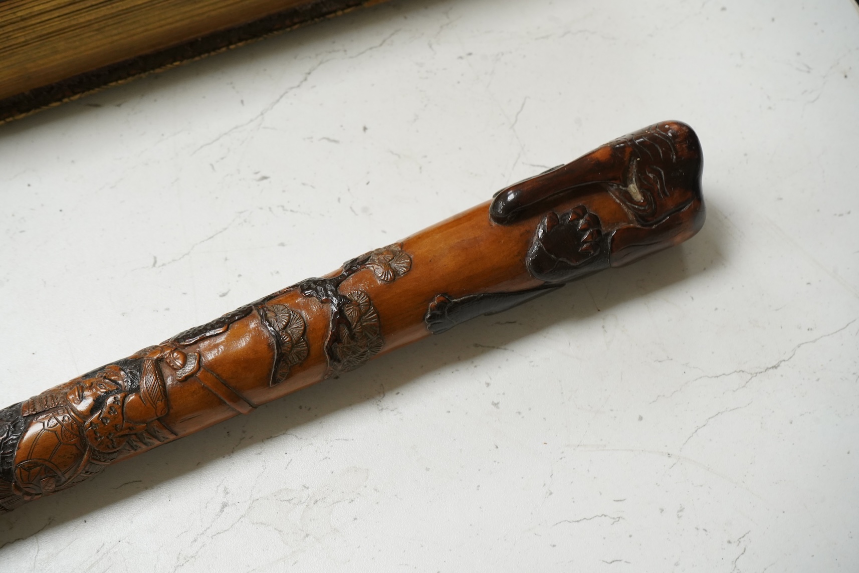 A late 19th century Japanese carved walking stick, with elephant handle, 95cm high